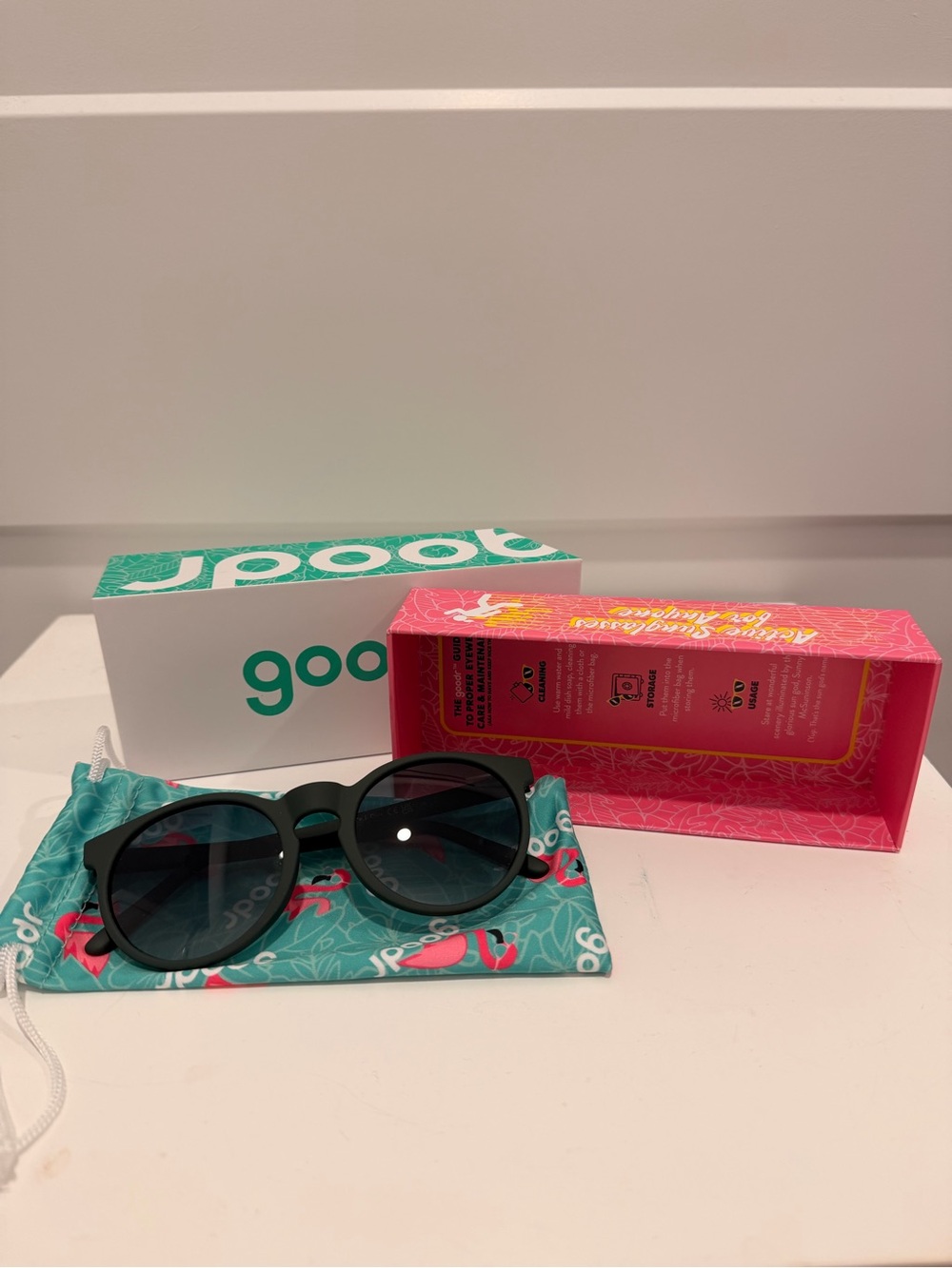 Goodr Matte dark green Round Sunglasses with Teal Flamingo Pouch